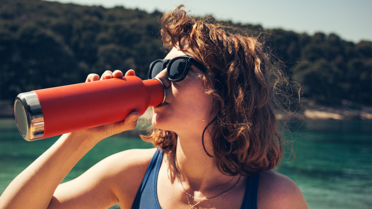 girl-drinking-from-reusable-water-bottle