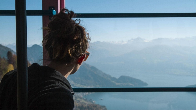 example_interrail_trip_-_girl_watching_the_view_of_mount_rigi_in_a_moving_cablecar_switzerland_5