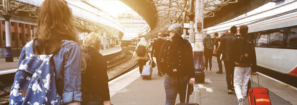 masthead-people-walking-on-train-platform