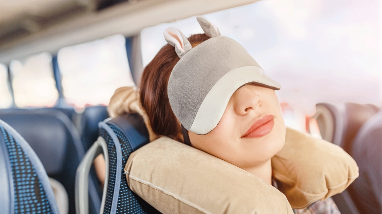 woman-sleeping-on-train